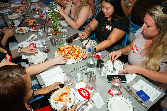 Yelp Elite members enjoying event with food at Jay Luigi Italian